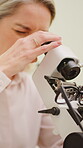 Glasses, woman optometrist or microscope in office, identify lens features or optical center location. Verify prescription, specs or mature optician with lensmeter for quality check, examine or test