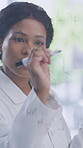 Scientist, woman and writing formula on glass wall for molecule structure, drug trail or innovation. Chemistry, black person or equation in laboratory for medical research, chemical compound or study