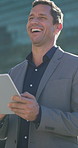 Business, laughing and tablet with man in city for break, communication or travel to work. App, commute and funny with happy employee person outdoor in urban town for feedback, reaction or review