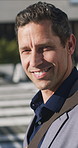 Face, walking and business man in city for travel, morning commute and lawyer on urban journey. Portrait, smile and professional outdoor on trip, moving and mature attorney with confidence in Italy