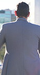 Back, businessman and thinking in city with idea for architecture, investment and urban planning. Outdoor, architect and person for downtown property development, opportunity reflection and decision.