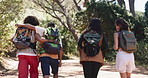 Back of friends, trail and hug with hiking outdoor for summer, bonding and support in woods. People, backpacking and together with trekking for exercise, wellness and walk in nature for adventure