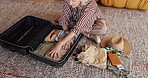Home, packing and senior woman with suitcase to prepare for travel, vacation and leaving for trip. House, above and mature person with clothing, passport and luggage for tourism, journey and holiday