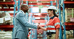 Man, woman and shaking hands at warehouse for shipping, praise or thanks with discussion at logistics company. Mature CEO, employee and handshake for success, support and goals at distribution center