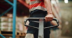Warehouse, delivery and hands with pallet truck, loader and restock for goods distribution and pull. Moving, cargo and person with equipment for supply chain in factory, merchandise and shipping