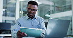 Business, laptop and black man on tablet in office for finance review, research and investment. Corporate, professional and person on digital tech for financial report, proposal or website for budget
