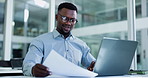 Black man, laptop and accountant with documents for finance, company budget or expenses in office. Businessman, accounting or paperwork with computer for corporate bills, cost or financial audit