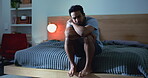 Lonely, man and thinking in bedroom, night and overwhelmed by financial crisis, sad or mental health. Unhappy, reflection  and stress for unemployment in home, late and person with depression or debt