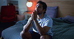 Night, thinking and man in bedroom, depression and prayer with insomnia, mistake and frustrated. Evening, house or person with ptsd, sleep disorder or anxiety with mental health, grief and sad memory