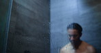 Shower, glass and man with grooming, sad and emotional with depression, mistake and cleaning. Reaction, house and person with anxiety, washing and treatment with water droplets, crying and splash