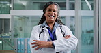 Face, doctor and happy woman in hospital, arms crossed and confidence with career ambition. Mature person, medical service and professional in clinic, pride and smile with healthcare and wellness