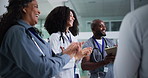 Applause, celebration and group of doctors in hospital for collaboration on medical milestone. Congratulations, smile and team of healthcare people with patient success in medicare clinic lobby
