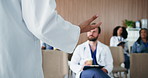 Hands, speaker or doctors with healthcare workshop in conference room, surgical training or talking. Listening, medical seminar or presenter with description of surgery procedure, people or speech