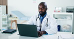 Black man, doctor and reading with laptop in office for research, medical report and patient history. Person, pc and document for Telehealth, healthcare records and information for treatment planning
