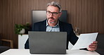 Businessman, glasses or paperwork in office with laptop for data analysis, financial report or audit. Mature person, eyewear or problem solving with computer for finance document, stats or accounting