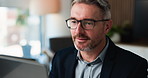 Mature man, laptop and glasses at office for proposal review, insight or project at insurance company. Person, broker or advisor with computer, feedback and perspective at risk management agency