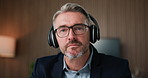 Face, businessman and webinar in office with headphones, financial advice and skill development. Mature person, virtual workshop or listening with audio tech, finance guidance or online consultation.