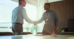 Business people, meeting and handshake with deal for corporate proposal or negotiation. Businessmen, employees or colleagues shaking hands with smile for partnership, b2b or onboarding in boardroom