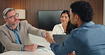 Business, people and interview with handshake in office for partnership, agreement and finance deal. Smile, team and shaking hands with laptop for financial approval, negotiation and funding proposal