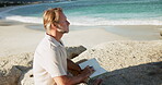 Beach, thinking or man writing in notebook for mental clarity, emotion reflection or awareness practice. Contemplating, reduce stress or person with gratitude journal for peace, thoughtful or outdoor