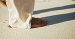 Outdoor, feet and walking on sand for holiday, summer travel and weekend trip for morning peace. Barefoot, soft ground and person in nature for getaway vacation, sunshine and tourism for wellness