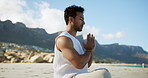 Calm man, beach and breathing with meditation for spiritual wellness, chakra or zen on ocean coast. Male person, inner peace or namaste with mudra or mantra for mindfulness or balance in nature