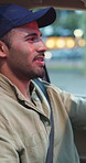 Man, driver and singing in car outdoor for travel, listening to music and karaoke fun. Male person, driving and dancing in vehicle with bokeh for radio, streaming playlist and check watch for holiday