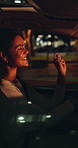 Woman, driver and dancing in car at night for travel, listening to music and groovy karaoke. Female person, driving or singing in vehicle for nightlife commute, streaming playlist and adventure audio