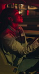 Black woman, driving and singing in car at night for travel, listening to music and karaoke. Female person, driver and dancing in vehicle for nightlife commute, streaming playlist and adventure audio