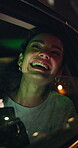 Car, window and woman with smartphone, night and sightseeing on road trip and laughing on adventure. City, view and person with mobile on vacation, happy and travel in vehicle or directions on web