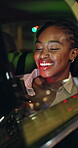 Night, laughing and black woman with mobile by car window, funny trend and viral post on social media. Happy, reading blog or person in dark vehicle with phone for texting, online humor and transport