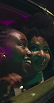Night, women and friends in car, window and sightseeing on road trip, laugh or bonding on adventure. City, tourism and people with smile in vehicle, together and travel on vacation, dark and journey