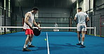 People, serving and padel games on court for fitness, match practice and swing technique. Back, men and hitting ball with racket for sports challenge, tennis competition and teamwork for tournament