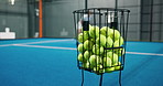 Padel, balls and basket at court for sports, training and practice for competition with people. Tennis players, equipment and gear for exercise, match and game for fitness with athlete in club