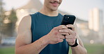 Fitness, outdoor and man with smartphone, hands and digital app to track progress. Person, exercise and athlete in city, cellphone and internet for social media, online chatting or message to contact