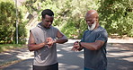 Old man, person trainer and smart watch with high five outdoor for success, fitness progress and achievement. Excited, men and check time for performance, monitor exercise and celebration for race