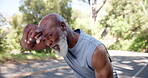 Tired, athlete and senior man on road, break and breathing after exercise and training for wellness. Outdoor, elderly runner and black person with workout for fitness, sweating or exhausted on street