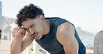 Fitness, rest or man at promenade with sweat, cardio challenge or breathing break in intense practice. Tired, burnout or athlete at beach with exercise, fatigue or recovery for performance goals.