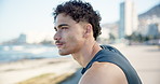 Beach, thinking and man with exercise, relax and workout for health benefits, thoughtful and wonder. Ocean, athlete and person with break, contemplation and fitness with nature, warm up and decision