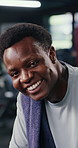 Black man, face and tired at gym with sweat, towel and happy with exercise, exhausted and rest. African person, fatigue and portrait with smile, burnout and confidence with training at fitness club