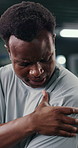 Fitness, injury and black man in gym with shoulder pain, accident or muscle sprain with workout. Arthritis, osteoporosis and African athlete with inflammation or hurt with exercise in sports center.