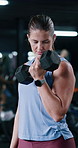 Bodybuilder, weightlifting and woman for exercise, training and fitness for endurance goals in gym. Dumbbell, person or athlete with arm strength, power workout or health challenge in sports center