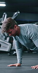 Fitness, push up or man in gym with exercise, power or cardio strength in endurance training. Determination, challenge or athlete with body press, intense workout or core stability in muscle gain.