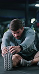 Exercise, fitness and stretching with man on gym floor for start of training or workout routine. Breathing, getting ready and leg warm up with person in health club for challenge or preparation