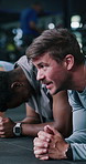 Fitness, plank or people with coach in gym, core strength workout or client motivation for challenge. Bokeh, endurance or personal trainer with abdominal exercise for body goals, training or talking