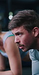 Fitness, plank or man with breathing in gym, core strength challenge or endurance for workout class. Exhale, concentration or athlete with abdominal exercise for goal, training or resilience practice