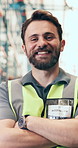 Crossed arms, man and face of logistics worker in warehouse with confidence for freight shipping. Happy, professional and portrait of supply chain manager with pride for quality control in factory.