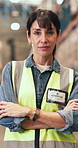 Crossed arms, woman and face of logistics worker in warehouse with confidence for freight shipping. Serious, professional and portrait of female supply chain manager with pride for quality control.