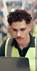 Man, laptop and review at warehouse for logistics, checklist and insight for inventory management report. Person, pc and notes for shipping, storage or schedule for supply chain at distribution plant