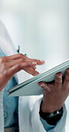 Hands, person and doctor with tablet in hospital for research, medical report and schedule surgery. Healthcare worker, digital and typing for telehealth, online checklist and information on operation